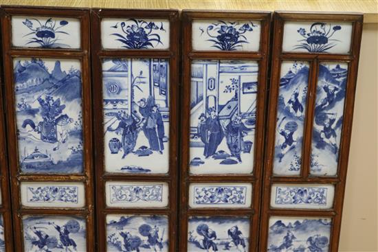 A 19th century Chinese blue and white porcelain panelled screen length 136cm